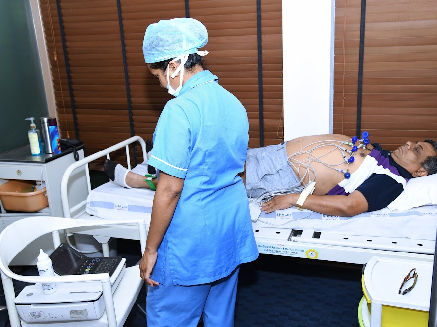 Medical professional performing a heart screening for a participant