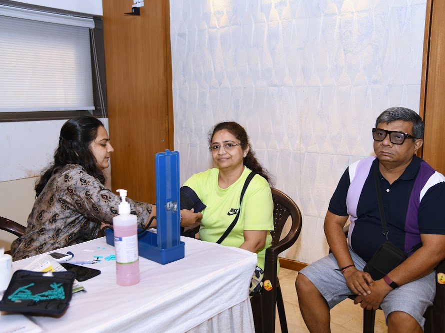 Medical worker checking a participant’s blood pressure